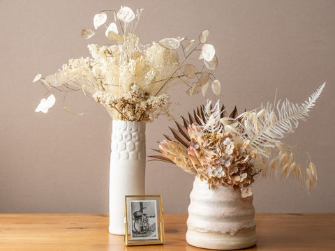 ceramic pottery vases and dried flowers