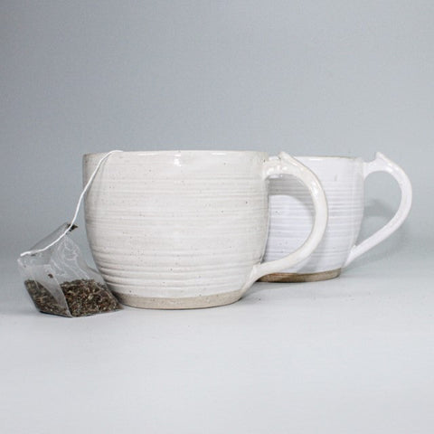 large white handmade mugs