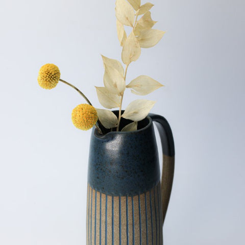 navy jug with dried flowers
