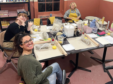 women at a pottery class