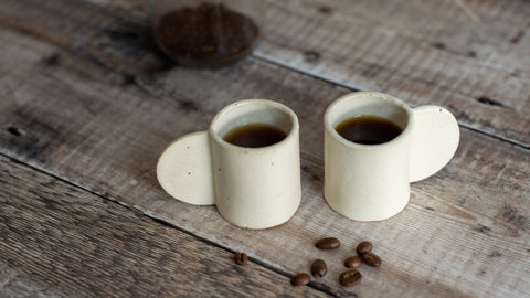 espresso cups with coffee and coffee beans