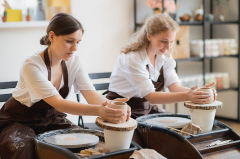 women in a pottery class