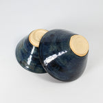 Load image into Gallery viewer, Two handmade denim blue pottery bowls stacked upside down 
