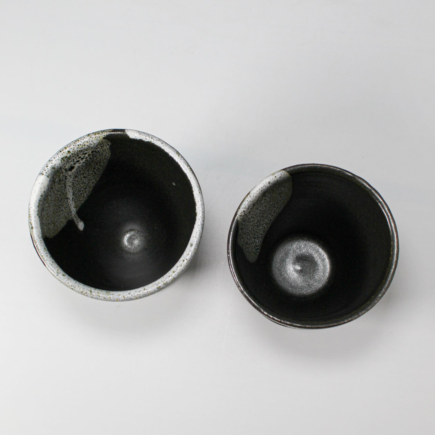 Pair of black and grey cups