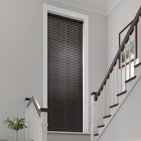Black wooden blind above staircase