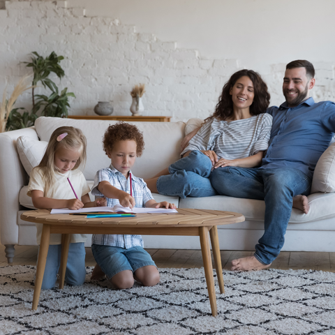 Family sitting in living room