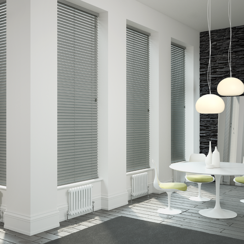 Grey wooden blind in a dining room