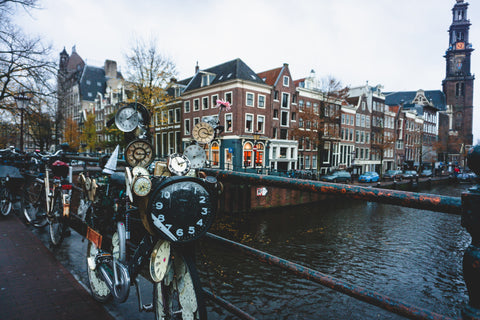 View from bridge overlooking Amsterdam's beautiful architecture and quirky clock bicycle.