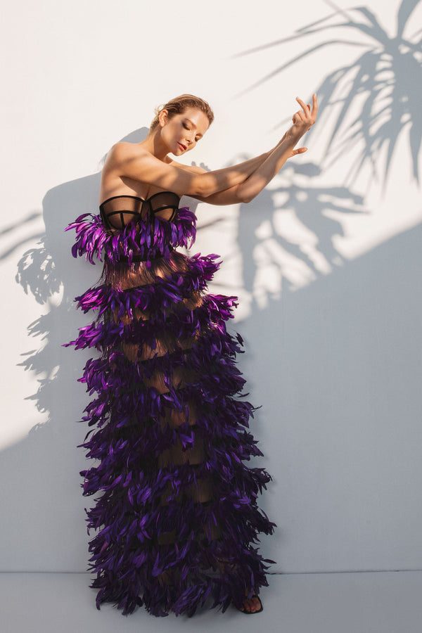 Asymmetrical purple dress with layered feathers