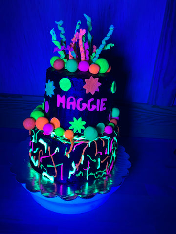 Neon Glow cake under black lights. This is a fun glow party birthday cake