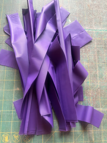 Strips of plastic tablecloths in a pile