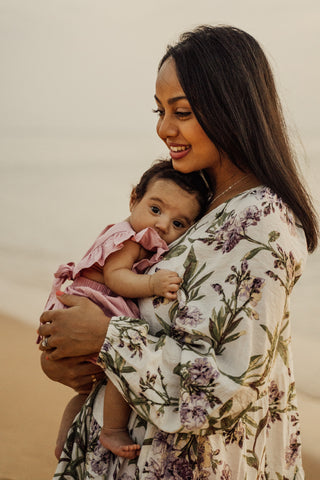 a mother holding her baby