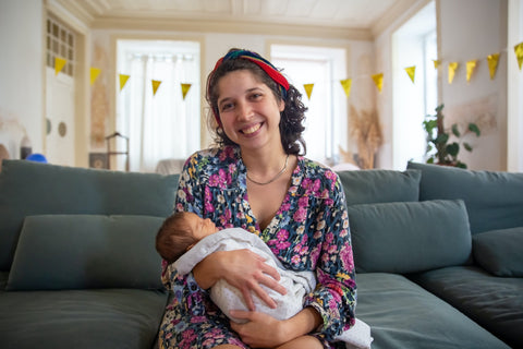 a mother holding her baby