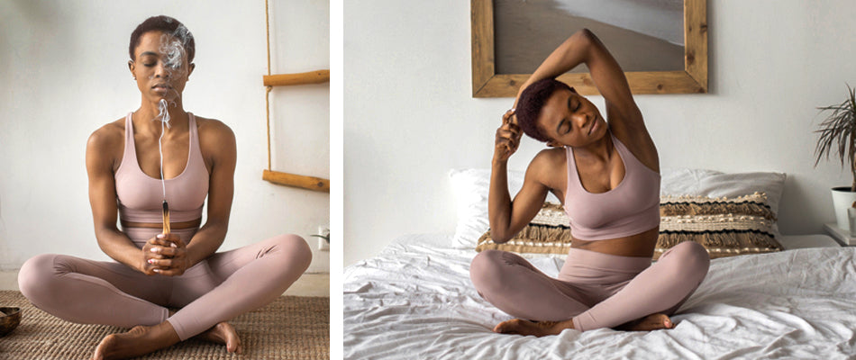 On the left, a woman is practicing relaxation techniques and is burning palo santo to cleanse.  She sits cross-legged on a woven mat.  On the right, the same woman sits cross-legged on a bed with her eyes closed.  She is stretching her arms.