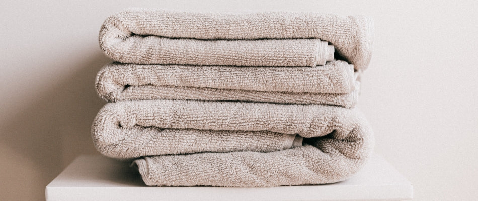 Close up of bath towels folded and stacked neatly.