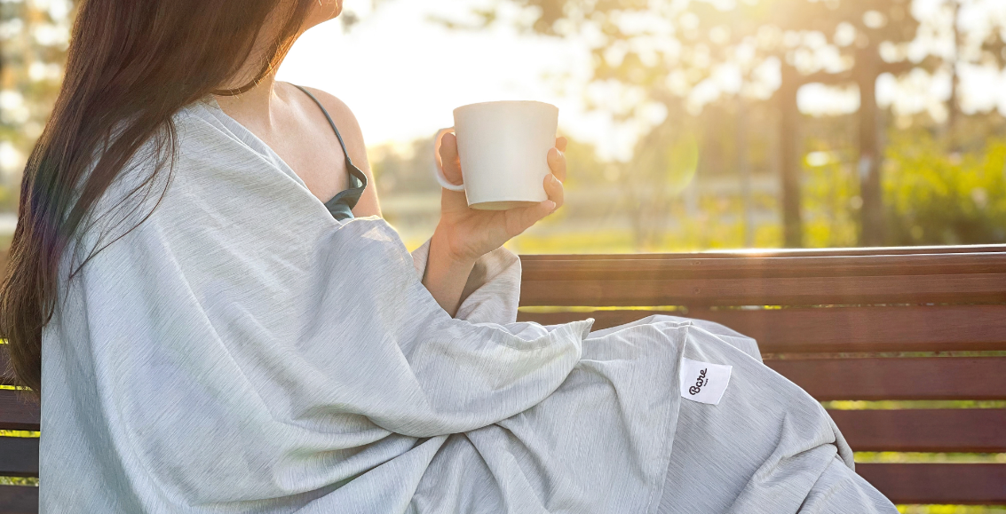 Picture of Woman in Bare Home blanket with a mug of Coffee