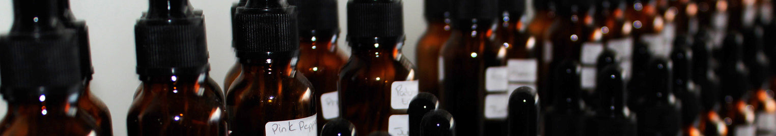 Perfumers organ: series of amber bottles containing different materials