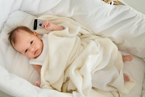 Baby in merino wool baby blanket