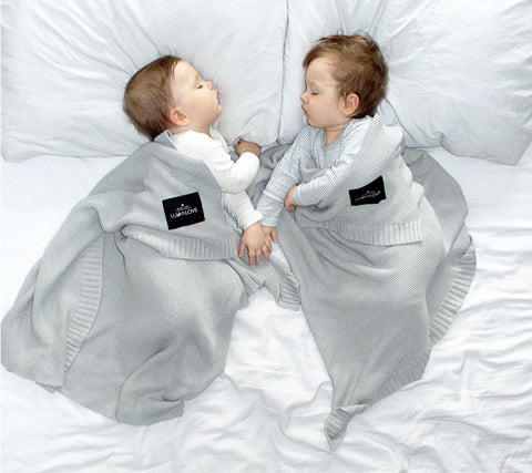 Two babies in bamboo baby blanket grey from Lullalove UK