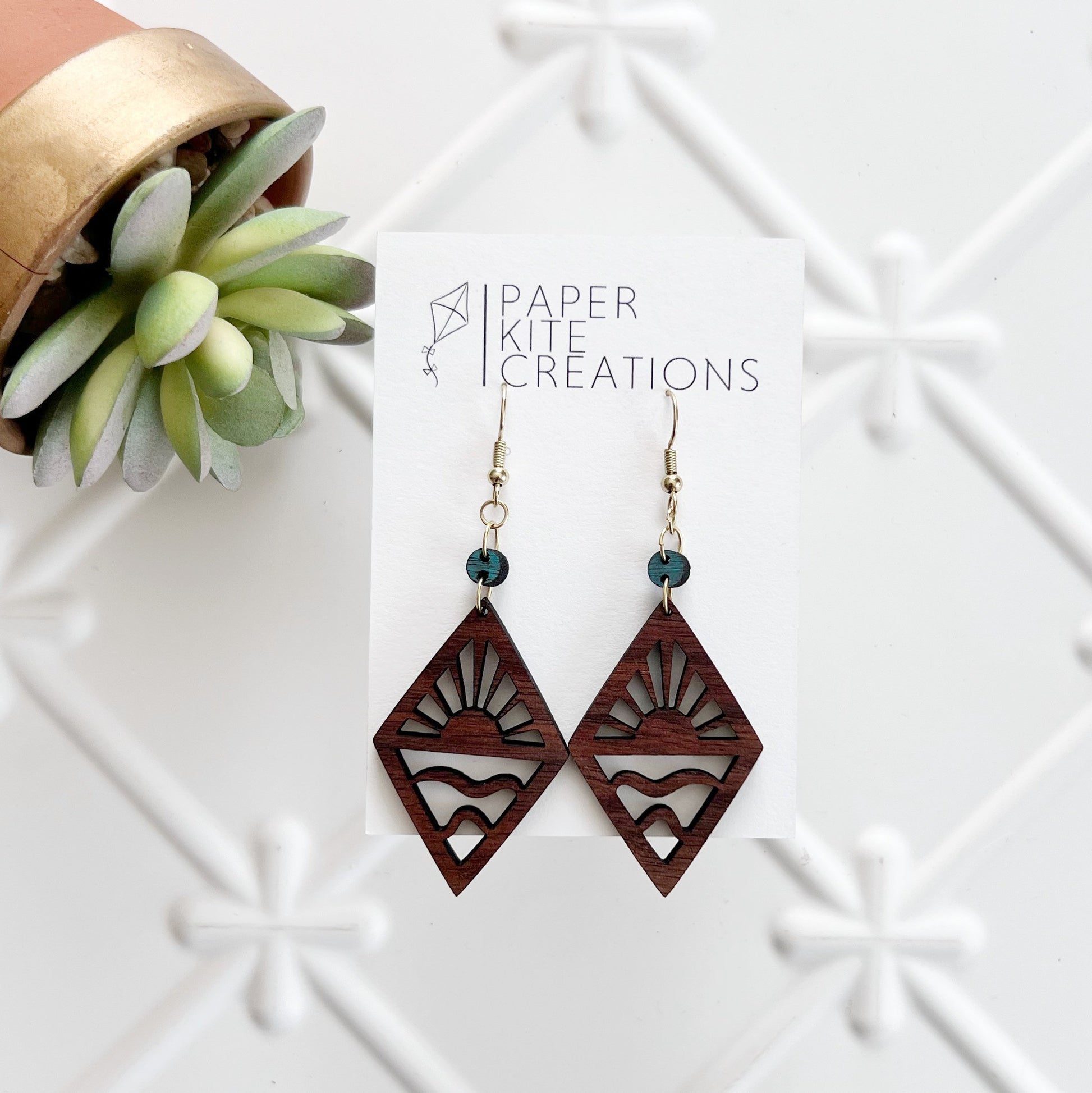 Natural Walnut Dangle with Sun and Water Design
