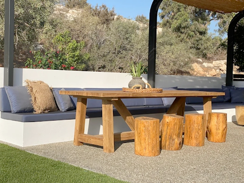 The Ithaka Dinning Table placed in a garden dining area