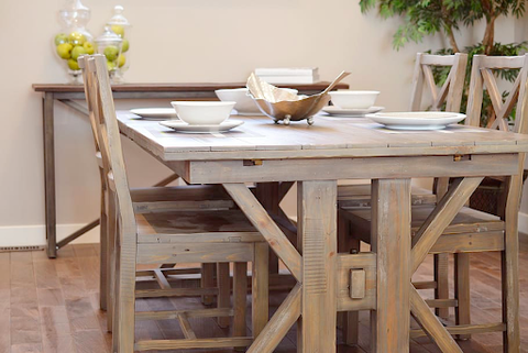 A wooden dining table with a unique design