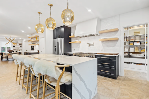 A kitchen with a white marble table