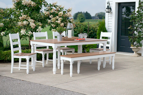 A dining table and chair set placed outdoors