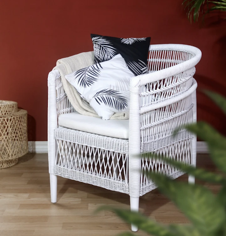 The Malawi White Chair with pillows on top