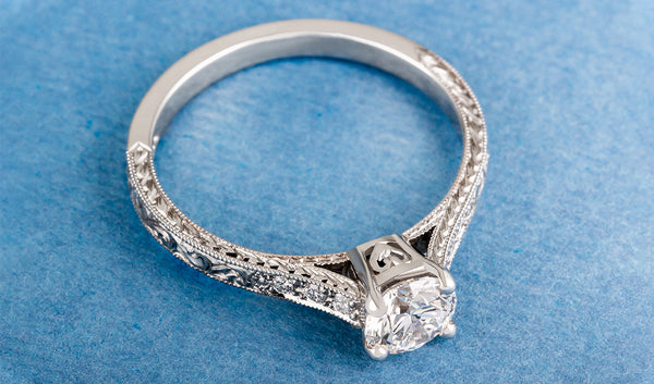 Cathedral Set diamond engagement ring in platinum engraved
