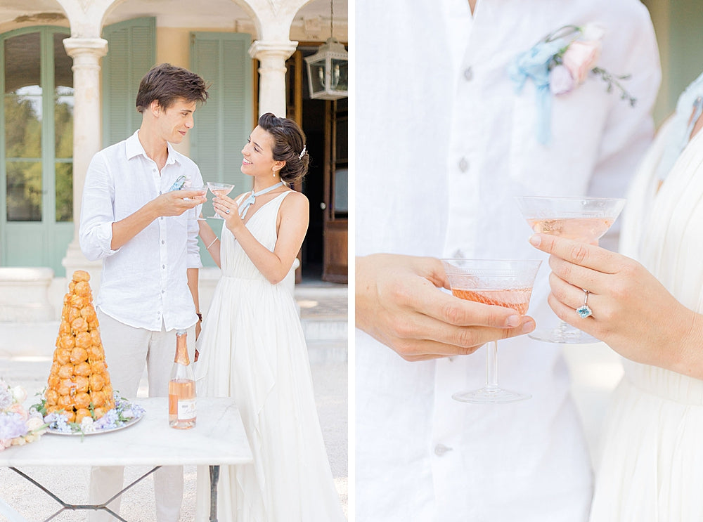 Bride and groom toast glasses in front of profiterole wedding cake