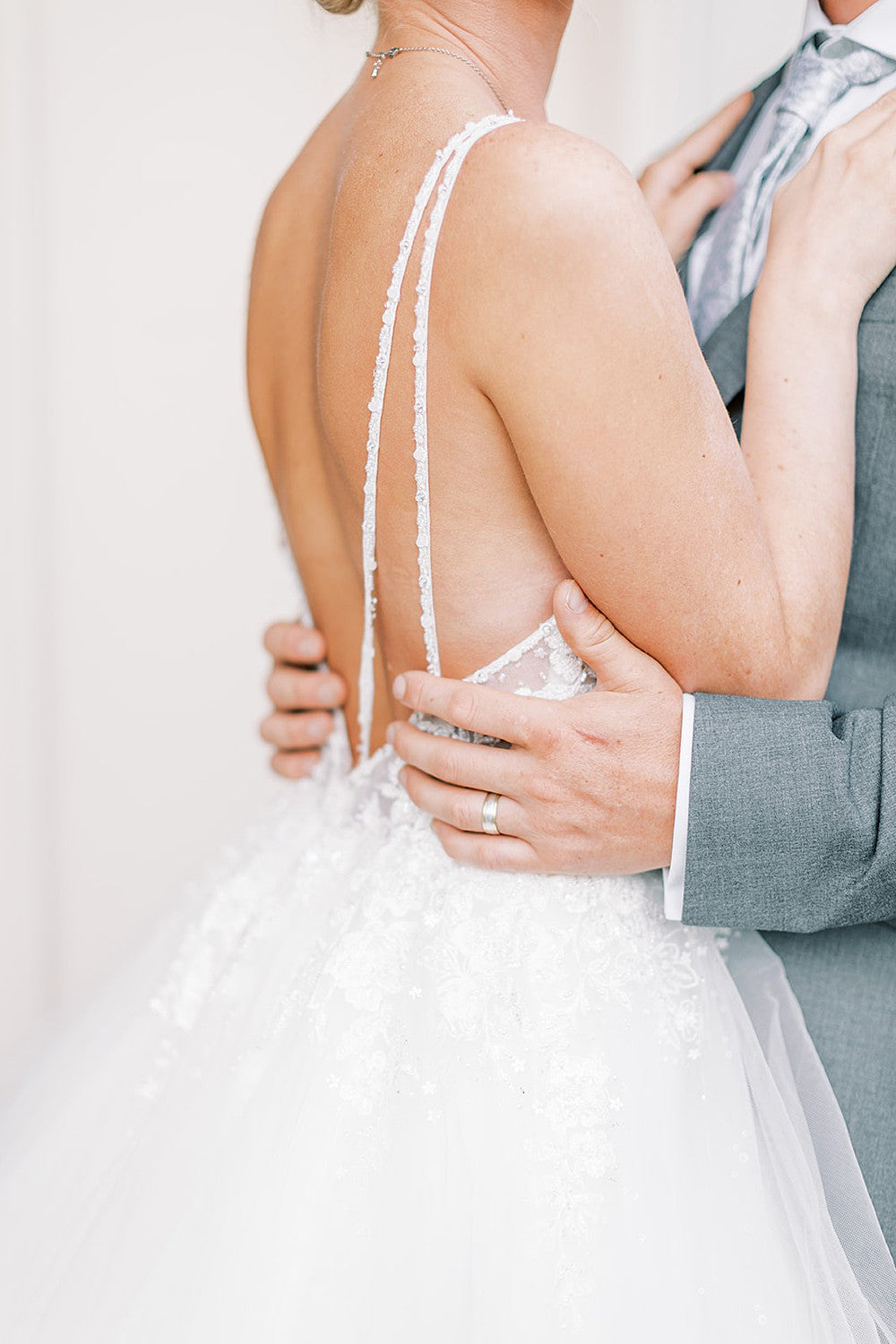 Groom wearing brushed wedding band