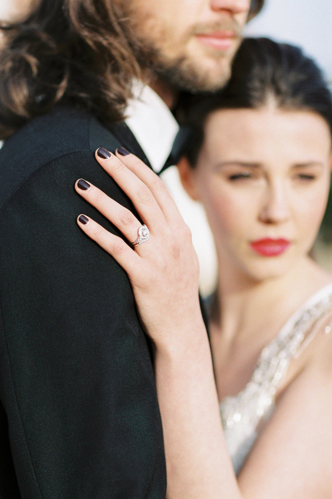 Vintage round diamond cluster ring with curved diamond wedding band