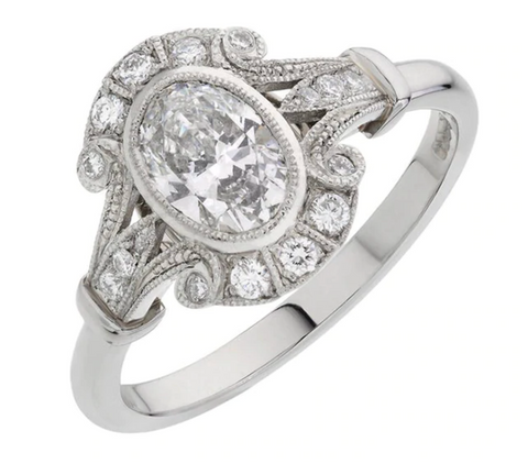 Oval Cut Diamond Cluster Ring in Platinum