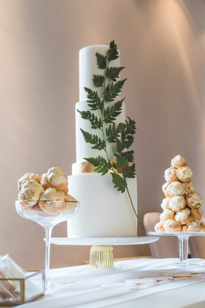 Three Tier White Wedding Cake with Green, Gold and Silver Accents and Cream Puff Profiteroles