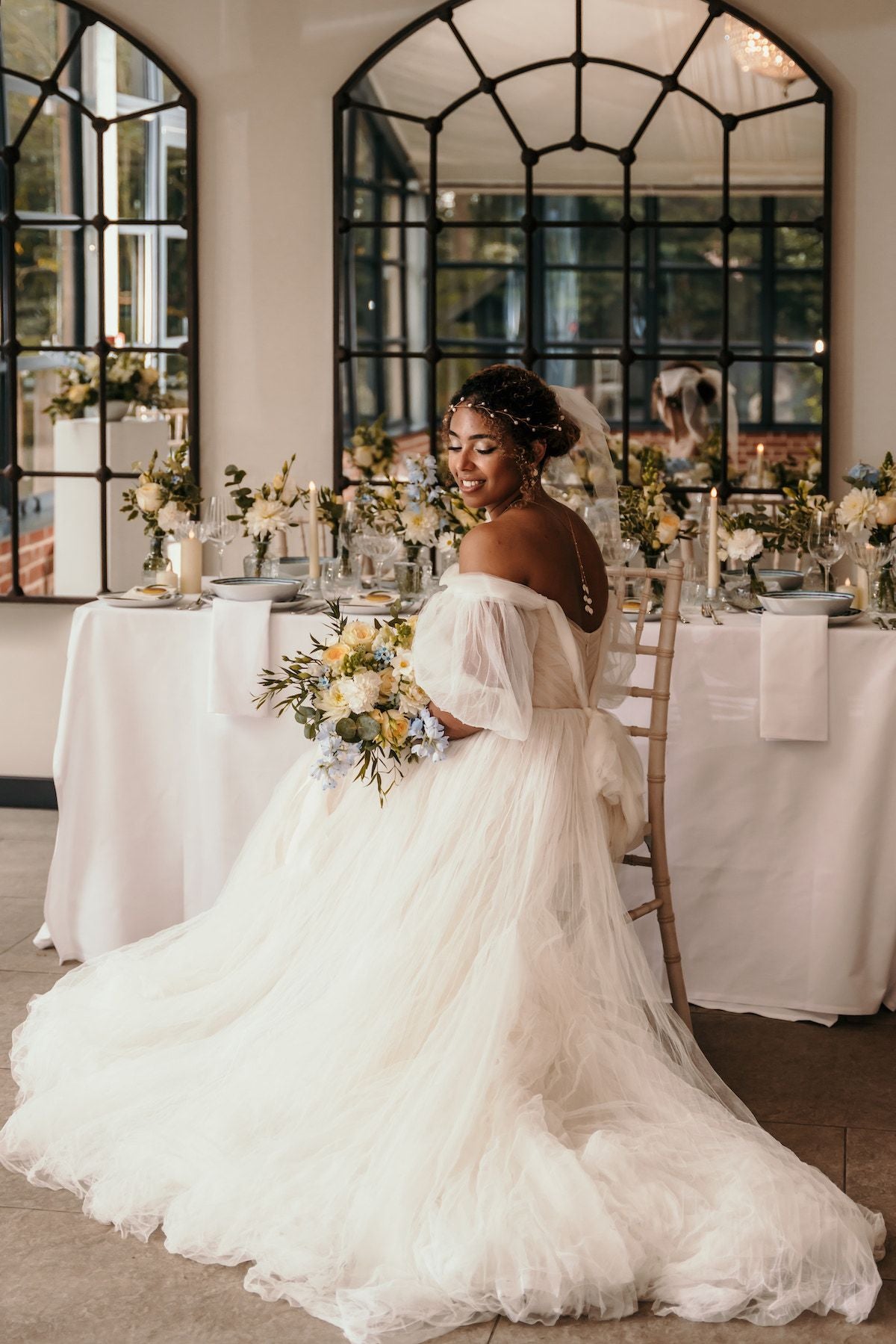 Bride at table inside Braddow Park House