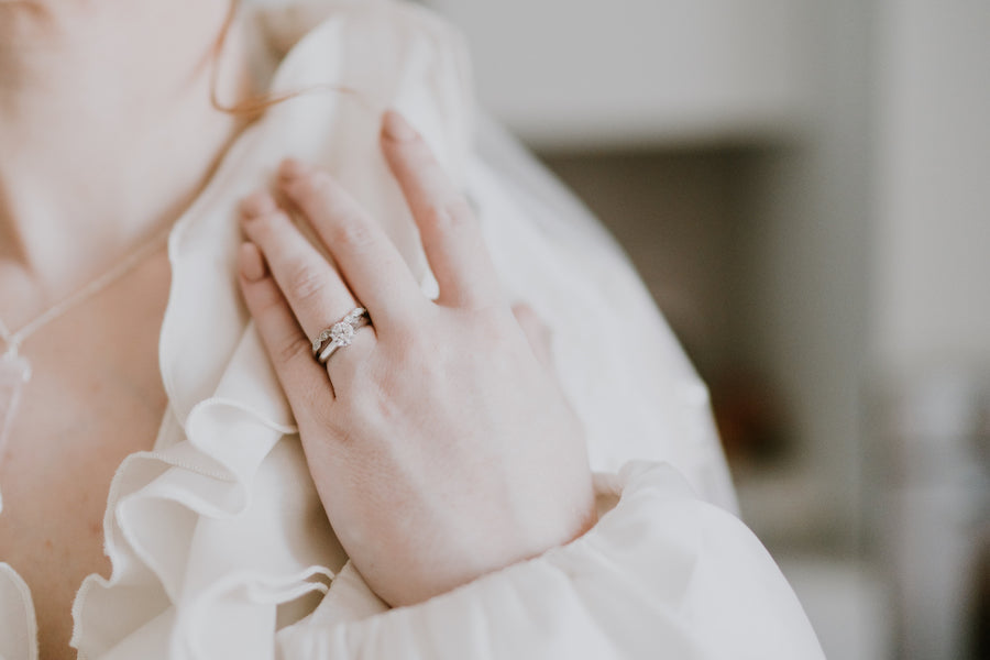 Diamond engagement ring with scalloped diamond wedding band