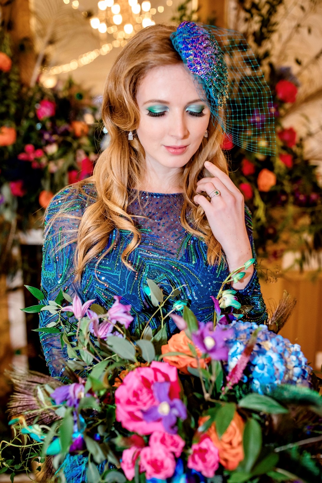 Peacock bride with emerald and diamond cluster ring bridal set