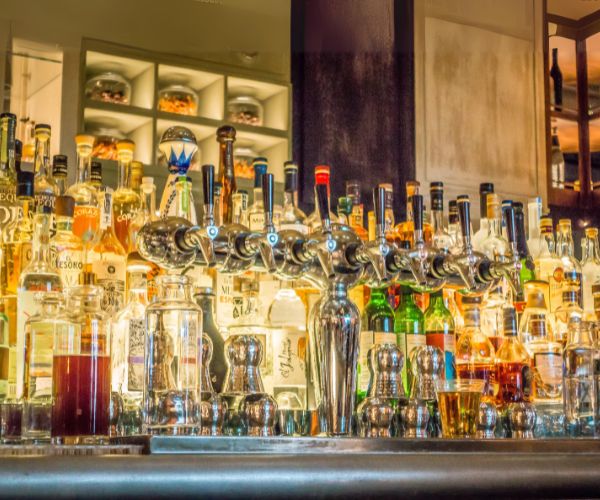 Bar counter with liquor bottles and beer tap