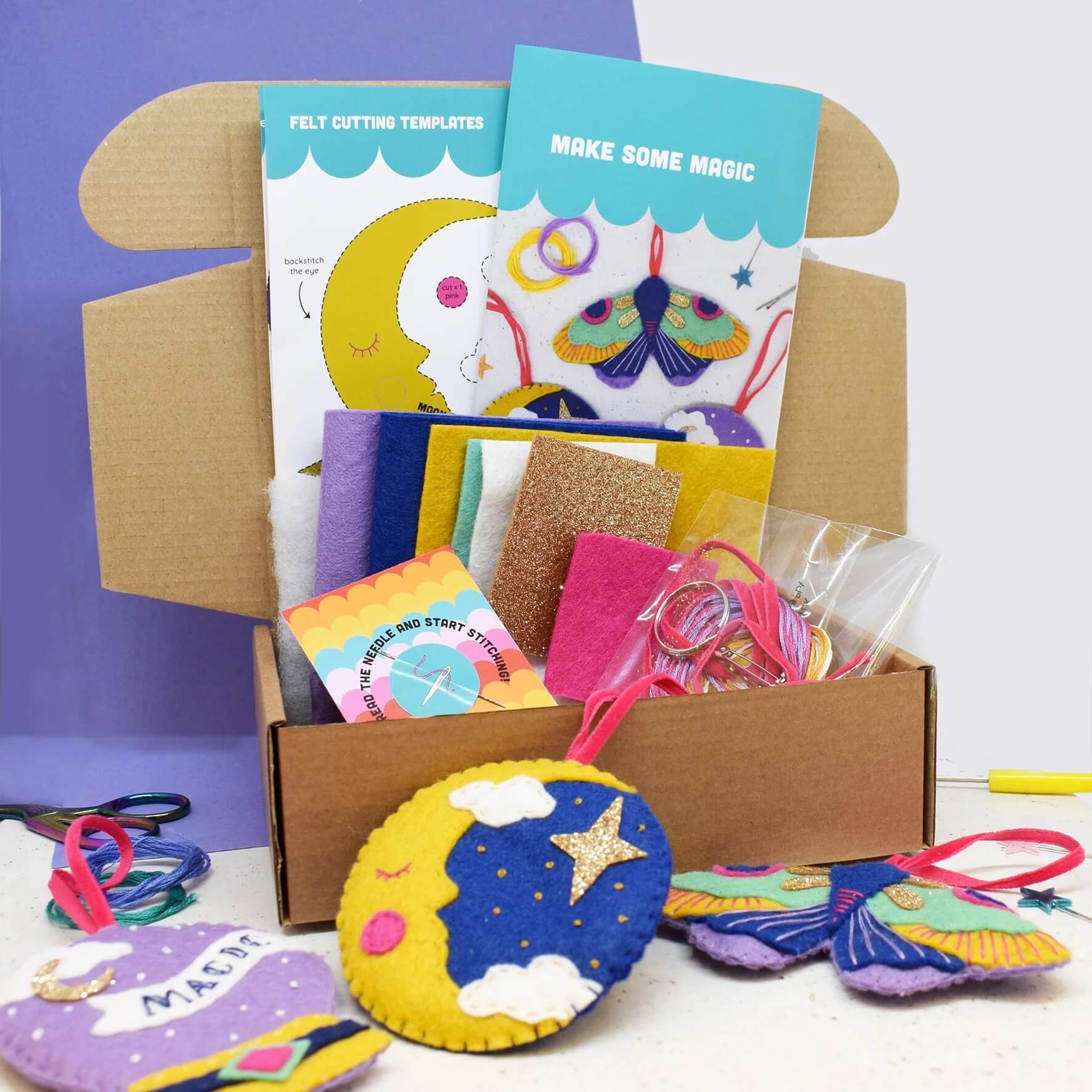 Box with contents of The Make Arcade Magic felt sewing craft kit with instructions