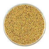 Yellow and brown mustard seeds ready to be soaked and stone ground