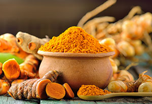 turmeric-roots-on-wooden-table