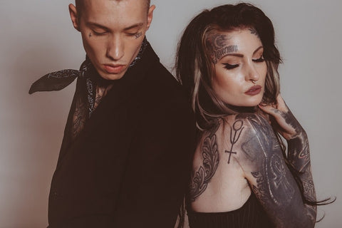 couple showing their tattoos