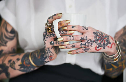 tattoo on hands, fingers, and arms