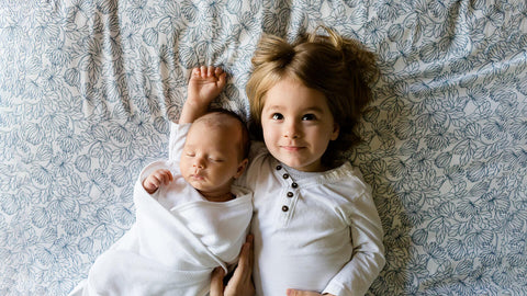 big brother with newborn sibling