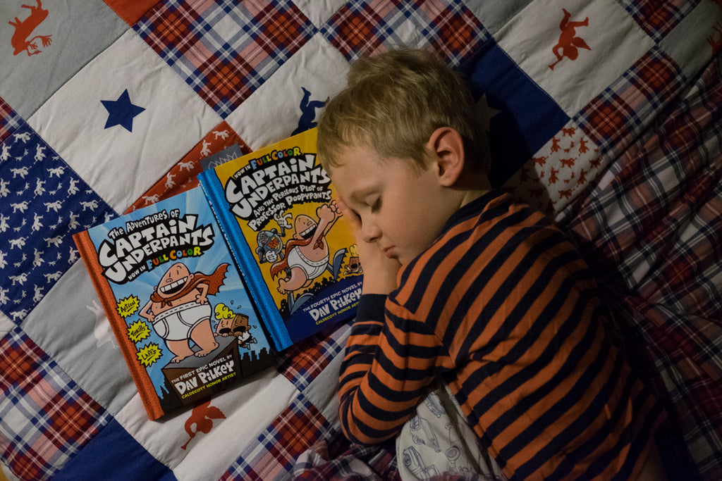 child falling asleep to reading captain underpants