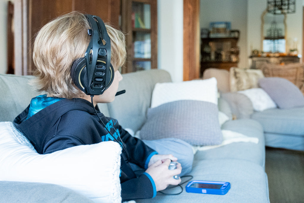 child playing video games with headset