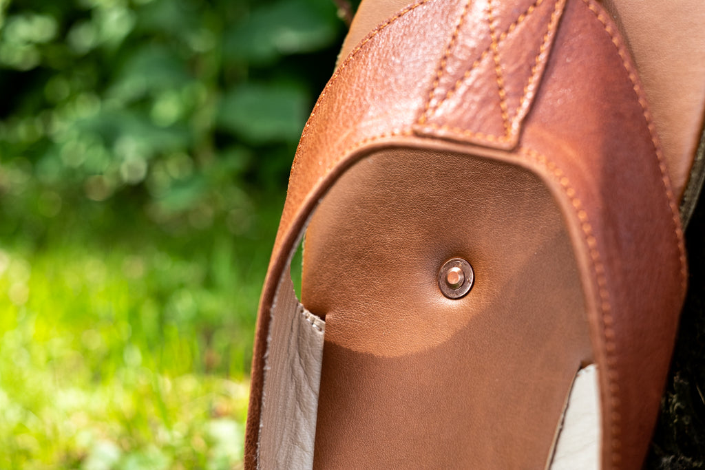 copper rivet inserted into the soles of sandals for earthing