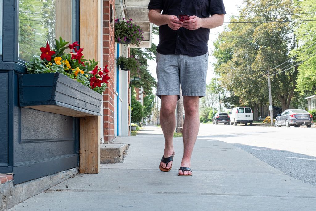 enjoying a summer stroll in cute down town with earthing sandals
