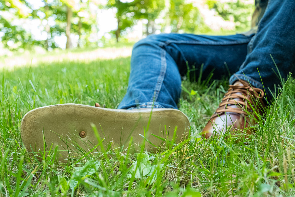 lying in the grass comfortably in the summer with earthing shoes